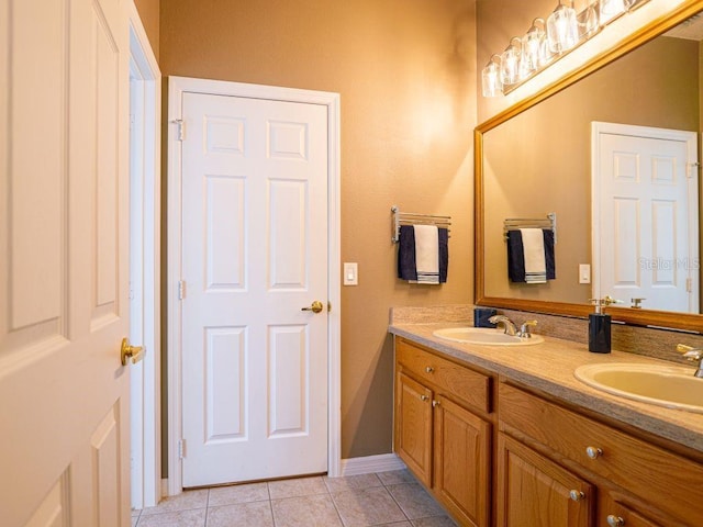 bathroom with vanity and tile patterned floors