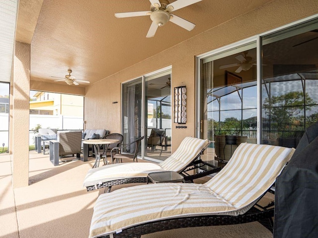 view of patio / terrace featuring ceiling fan