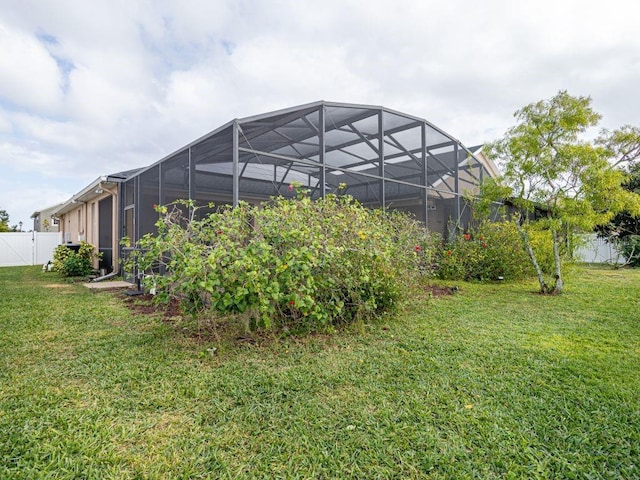 view of yard with a lanai