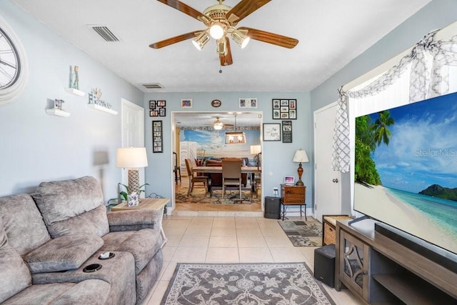 tiled living room featuring ceiling fan