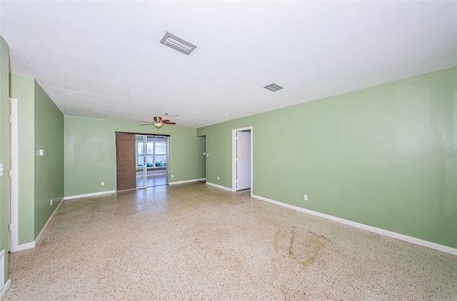 spare room with ceiling fan