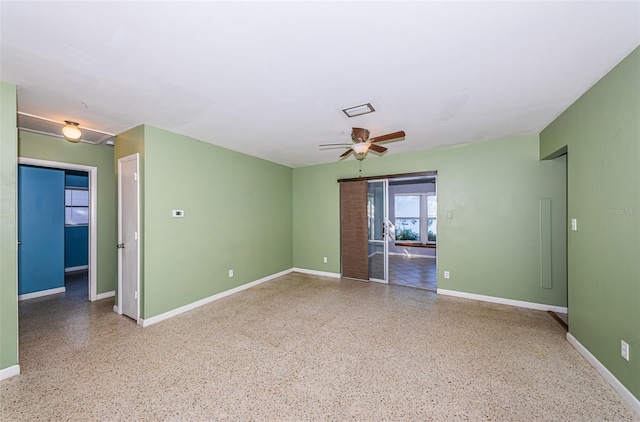 spare room with ceiling fan