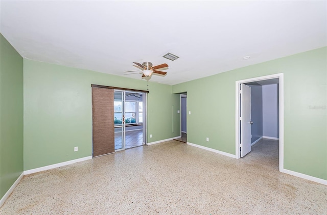 unfurnished room with ceiling fan