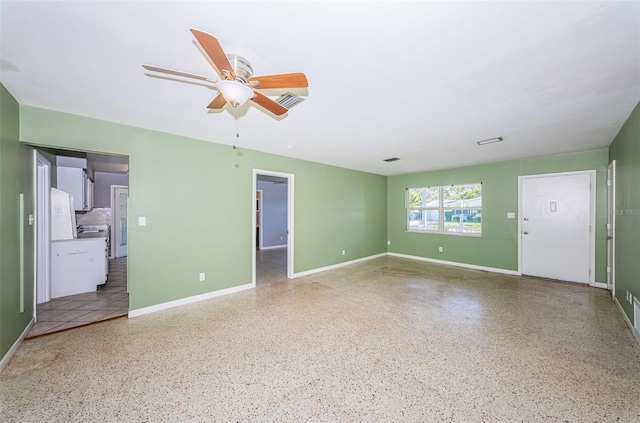 unfurnished living room with ceiling fan