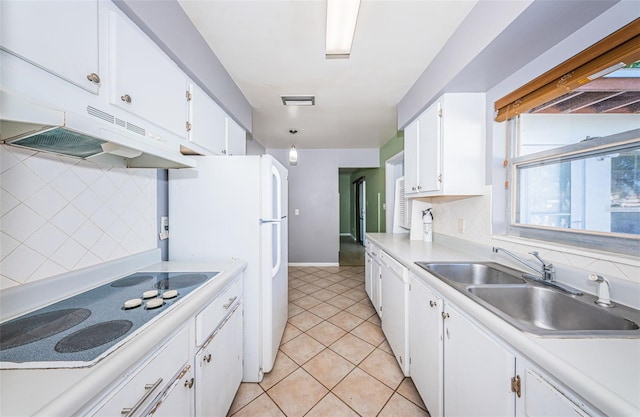 kitchen with sink, light tile patterned floors, white cabinets, white appliances, and tasteful backsplash