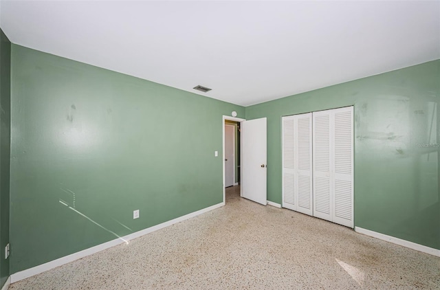 unfurnished bedroom with a closet