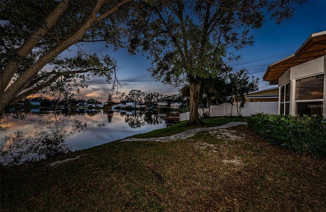 yard at dusk with a water view