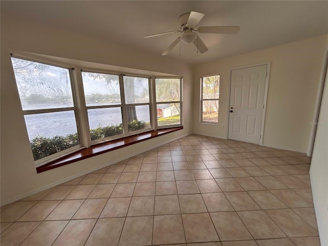 unfurnished sunroom with a water view
