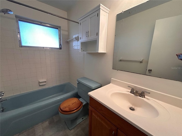bathroom with shower / tub combination, toilet, and vanity