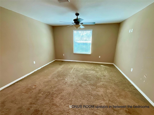 empty room with carpet floors and ceiling fan