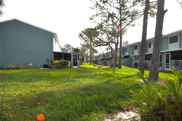 view of yard with a sunroom