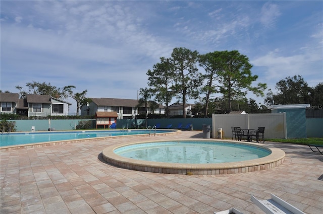 view of swimming pool featuring a patio