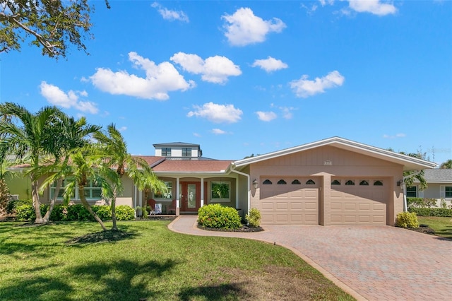 view of front facade featuring a front lawn and a garage