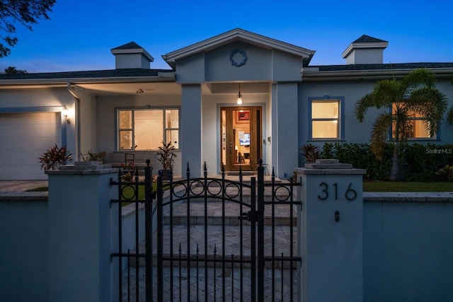 view of front of home with a garage