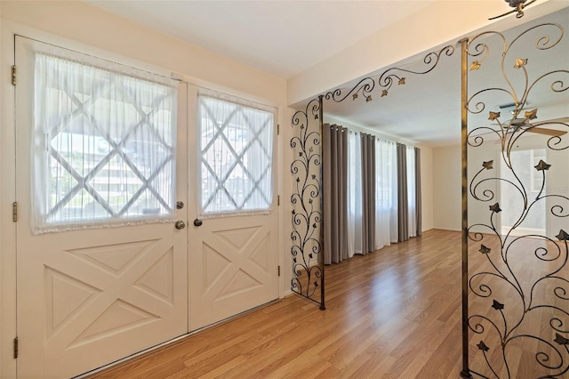 doorway featuring french doors and light hardwood / wood-style flooring