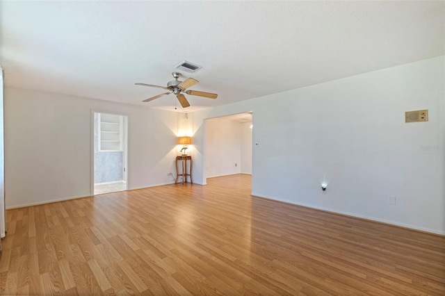 unfurnished living room featuring light hardwood / wood-style floors, a textured ceiling, and ceiling fan