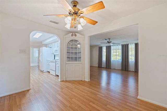 interior space with ceiling fan and light wood-type flooring