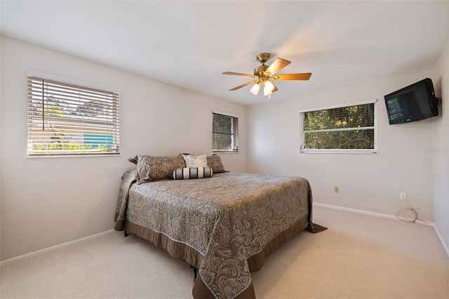 bedroom with ceiling fan and carpet floors