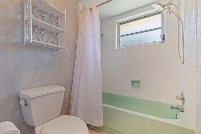 bathroom with toilet and shower / bath combo with shower curtain