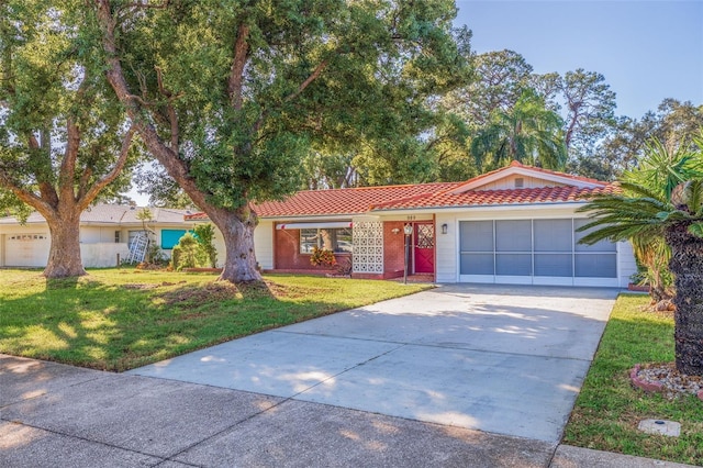 single story home with a front lawn and a garage