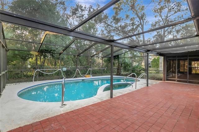 view of pool with a patio and a lanai