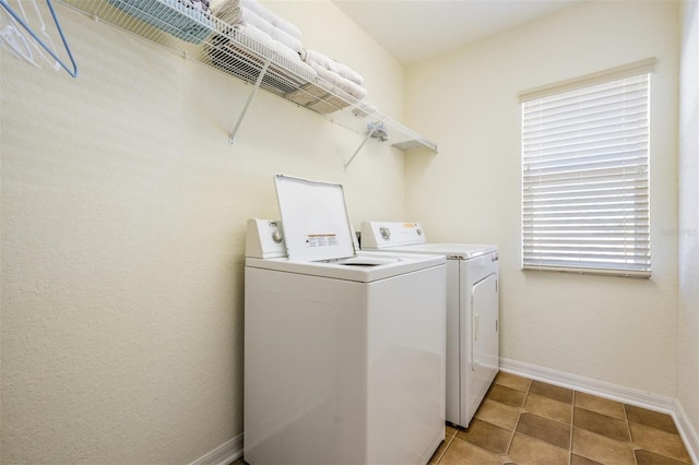 clothes washing area with washer and dryer