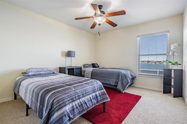 bedroom with ceiling fan and carpet flooring