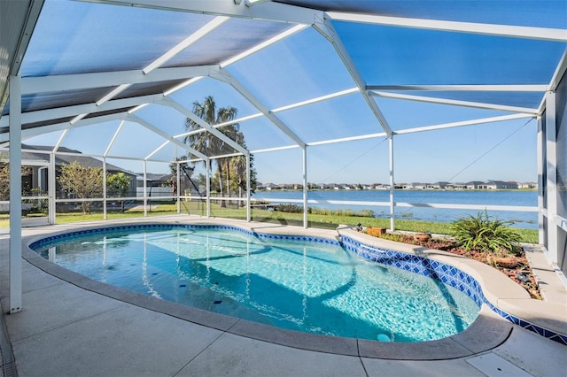 view of swimming pool featuring a patio area, a yard, a water view, and glass enclosure