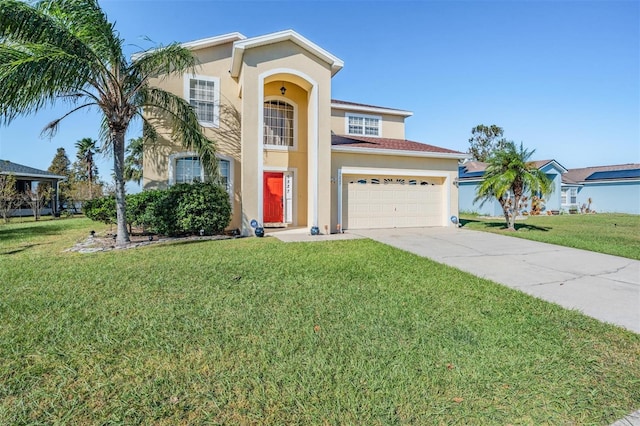 mediterranean / spanish home with a front yard and a garage