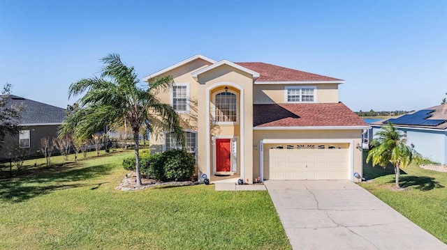 mediterranean / spanish-style home with a front yard and a garage