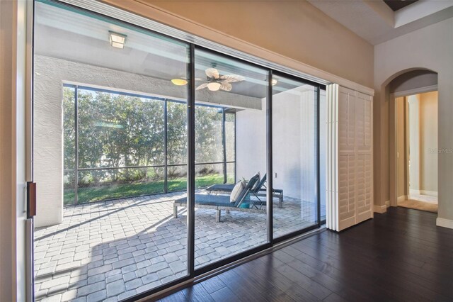 doorway with hardwood / wood-style flooring