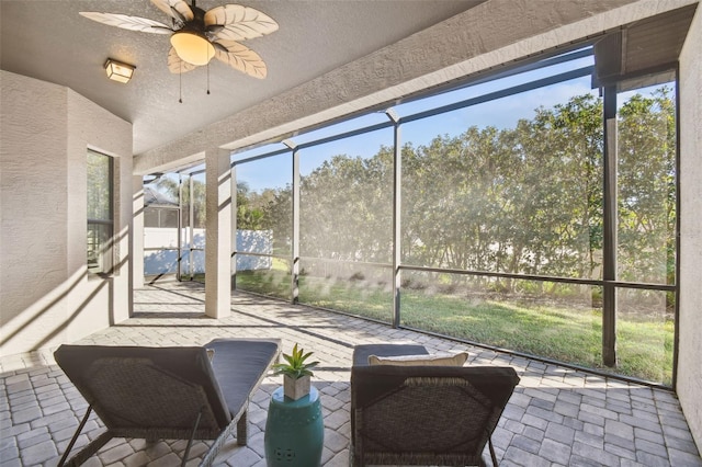 sunroom / solarium with ceiling fan