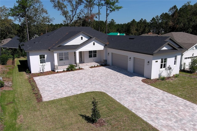 view of front facade with a front lawn and a garage