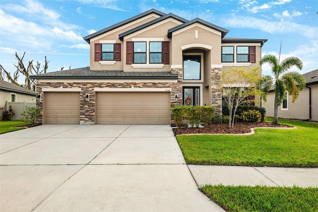 view of front of house with a front lawn and a garage