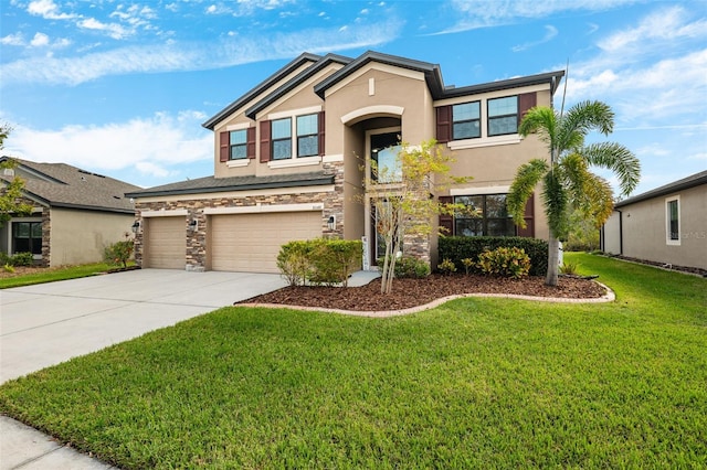 view of front of house with a front lawn and a garage