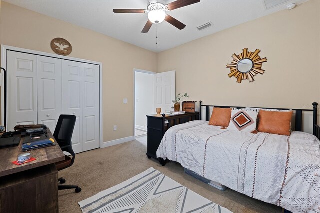 carpeted bedroom with a closet and ceiling fan