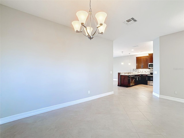 interior space featuring light tile patterned floors and an inviting chandelier