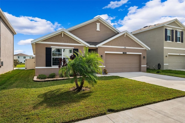 view of front of home with a garage and a front lawn