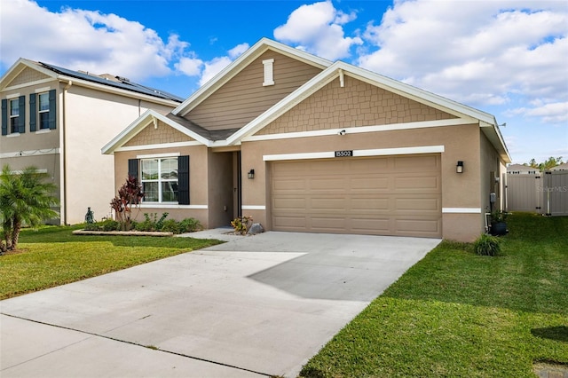 view of front facade with a garage and a front lawn