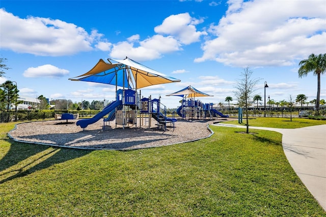 view of playground with a lawn