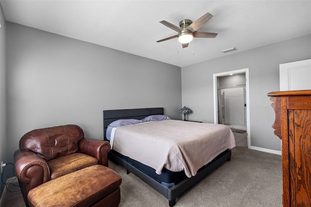 carpeted bedroom featuring ceiling fan and ensuite bath