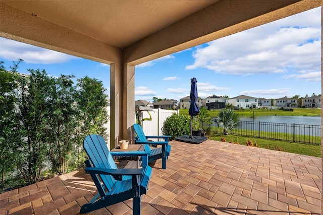 view of patio featuring a water view