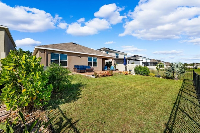 rear view of house with a lawn and a patio area