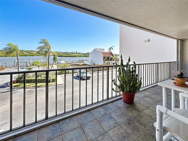 balcony featuring a water view