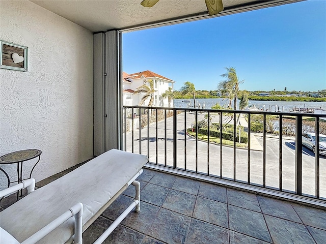 balcony featuring a water view