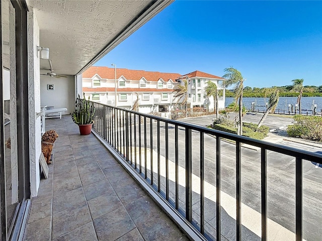 balcony featuring a water view