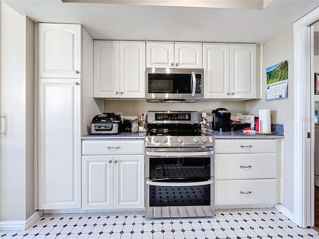 kitchen with white cabinetry and stainless steel appliances