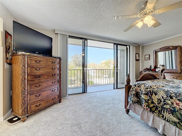 bedroom featuring floor to ceiling windows, light carpet, access to exterior, and a textured ceiling