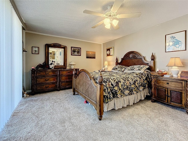 bedroom featuring ceiling fan, light colored carpet, crown molding, and a textured ceiling