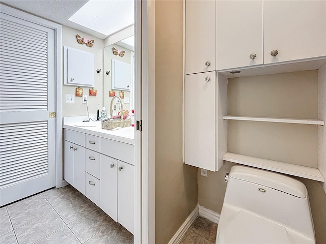 bathroom with vanity and tile patterned floors